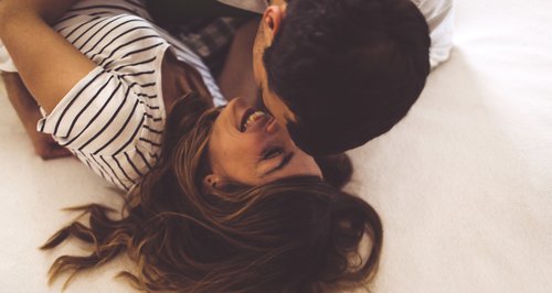 Couple cuddling and kissing