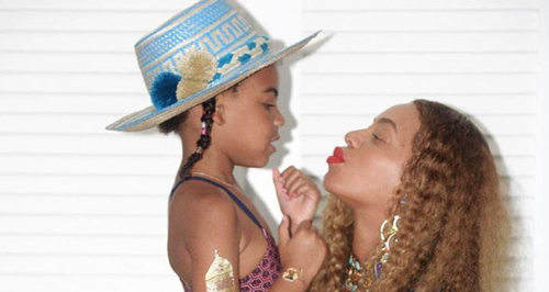 Beyonce balances Blue Ivy on her baby bump