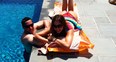 Sofia Vergara lying by a swimming pool 